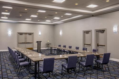 a conference room with a long table and chairs at Courtyard by Marriott Boston Billerica Bedford in Billerica