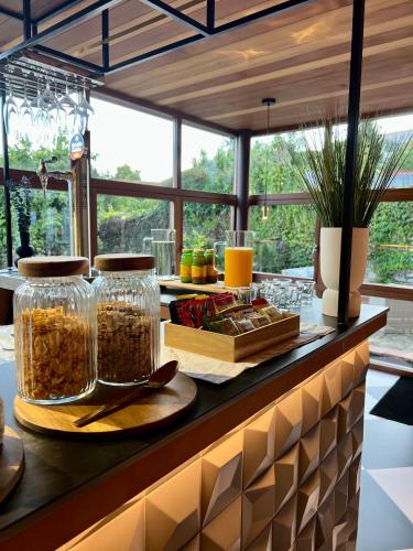 a kitchen with a counter with jars of food at The Tailor's Garden in Santiago de Compostela