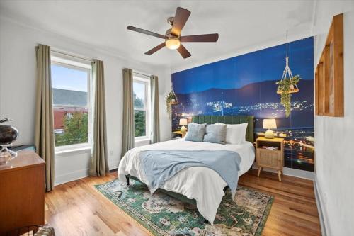 a bedroom with a large bed and a ceiling fan at Port CBus. Near OSU, Dining, Fun in Columbus