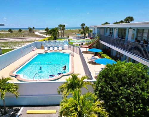 an overhead view of a swimming pool at a resort at Beachside Resort Motel in St Pete Beach