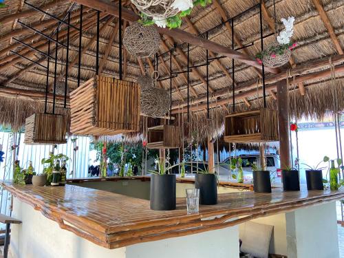 a bar in a restaurant with a wooden counter at Isabella Boutique Hotel in Playa del Carmen