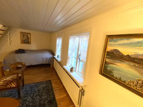a bedroom with a bed and a window at Day Dream Mjostraeti 10a in Reykjavík