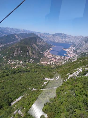 an aerial view of a valley with a river and a city at Brvnara Fairy Tale in Cetinje
