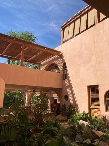 an external view of a building with a patio at Casa Liquen in Chacala