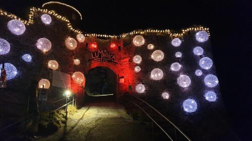 an entrance to a building decorated with christmas lights at Chalet Panorama Tirol in Hofen