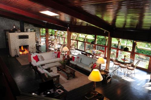 an aerial view of a living room with a fireplace at Hotel Daniela in Penedo