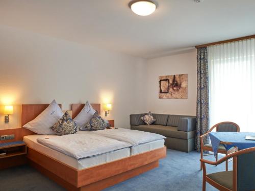 Hotel Münster tesisinde bir odada yatak veya yataklar