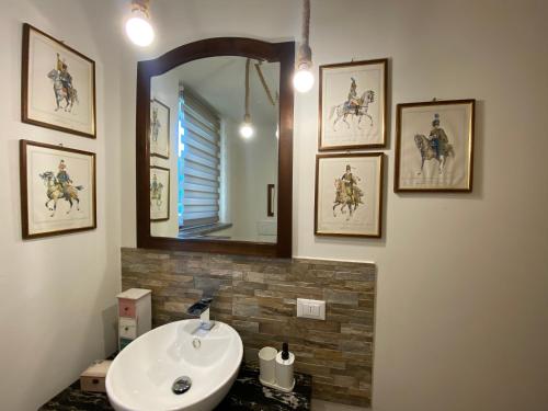 a bathroom with a sink and a mirror at Cascina Vica Biella in Andorno Micca