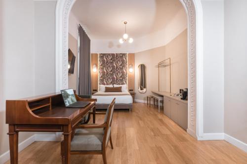 Postel nebo postele na pokoji v ubytování Belle Epoque Suites