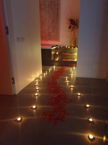 a room with lights and flowers on the floor at Nest House & Relax in Civitanova Marche