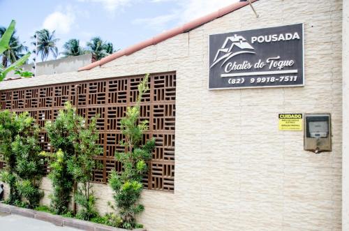 Pousada Chalés do Toqueに飾ってある許可証、賞状、看板またはその他の書類