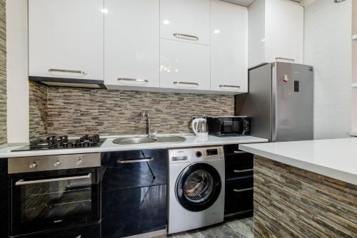 Una cocina o cocineta en Cozy Apartment