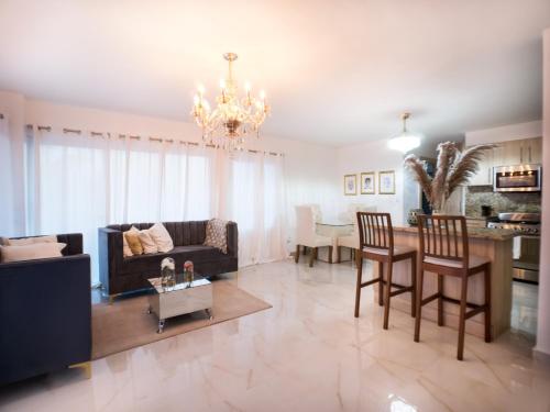 a living room with a couch and a table at Coconut Paradise Beach Hotel in Pajarito