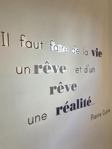 a writing on the side of a white refrigerator at VILLA GABY~ 2 pers ~ Hypercentre in Pau