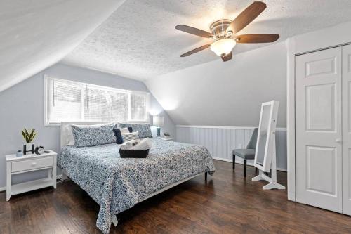 a bedroom with a bed and a ceiling fan at The Bamboo House! Dog-Friendly Home n RVA Sleeps 8 in Richmond