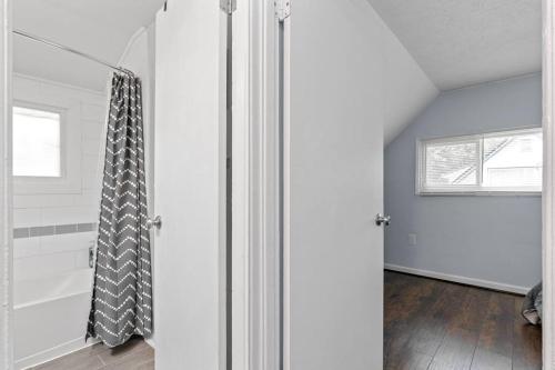 a white room with a shower and a window at The Bamboo House! Dog-Friendly Home n RVA Sleeps 8 in Richmond
