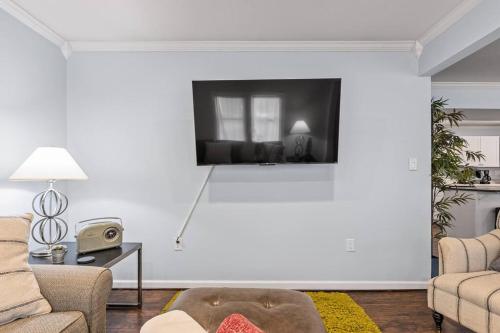 a living room with a large white wall at The Bamboo House! Dog-Friendly Home n RVA Sleeps 8 in Richmond