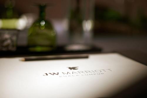 a paper with the new marriott logo on it at JW Marriott Kuala Lumpur in Kuala Lumpur