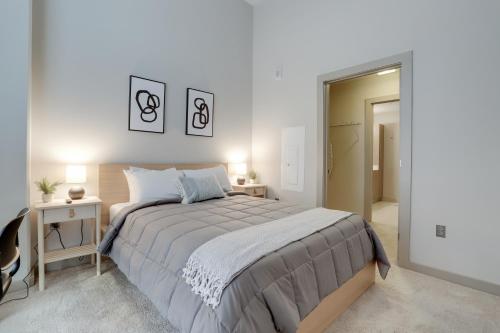 a white bedroom with a large bed and a mirror at Fantastic Condo 1BR at Crystal Flats in Arlington