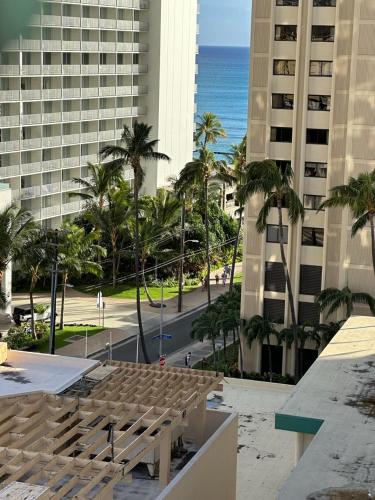 a view of the beach from the balcony of a building at WELLCOME TO LOVELY CONDO 2 BEDS 2 BATHS FREE PARKING IN WAIKIKI BEACH in Honolulu