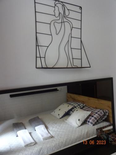a bedroom with a bed with a stained glass window at Apartament Wspólna 59 Warszawa in Warsaw