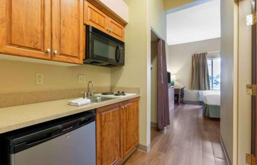 a kitchen with a sink and a microwave at Extended Stay America Suites - Findlay - Tiffin Avenue in Findlay