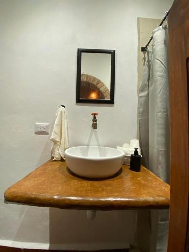 a bathroom with a white sink on a counter at Casa Laberinto in San Miguel de Allende