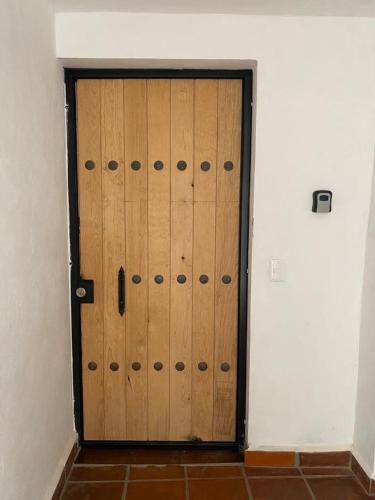 a pair of wooden doors in a room at Casa Laberinto in San Miguel de Allende