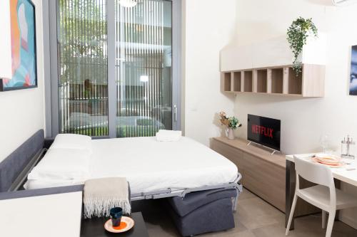 a hospital room with a bed and a desk at Monviso Exclusive Apartment in Milan