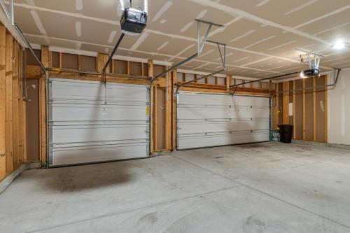a garage with two garage doors in a room at Cozy Cartersburg Home about 14 Mi to Indianapolis in Cartersburg