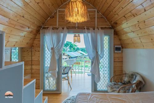 Una cama o camas en una habitación de Strawberry Guyabano Farm