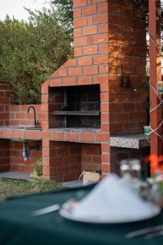 a brick oven with a sink in a yard at Casona Plaza Ecolodge Colca in Yanque