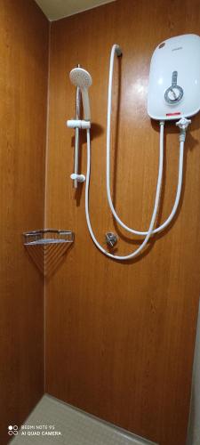 a hose hooked up to a wall with a hair dryer at AYMAR Homestay, Residensi Lily, Nilai in Nilai