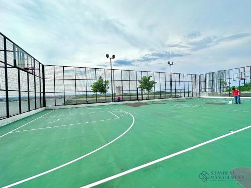 a tennis court with a person standing on it at Melaka Novo 8 Residence - Jonker Street by Stayrene in Melaka