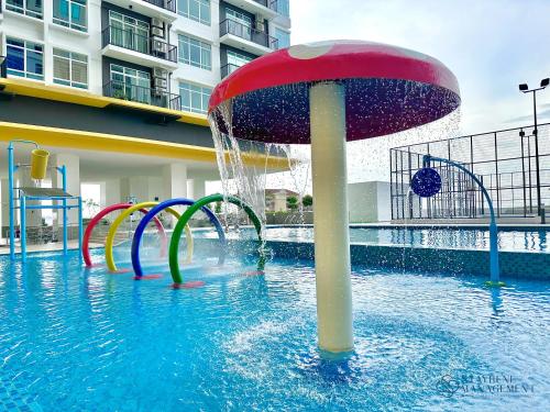 a pool with a water park with a water slide at Melaka Novo 8 Residence - Jonker Street by Stayrene in Melaka