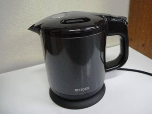 a black appliance sitting on top of a counter at KKR Kawayu in Teshikaga