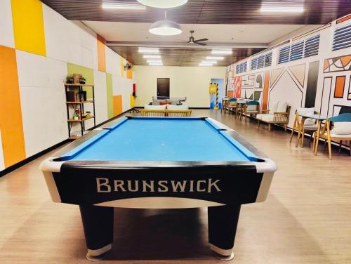 a pool table in the middle of a room at Richjones Bed & Breakfast in Manila