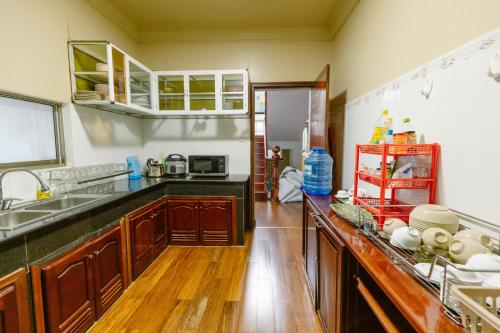 a kitchen with a sink and a counter top at BACH TUNG Garden Village Đà Lạt in Xuan An