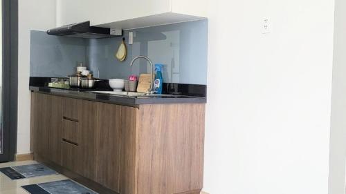 a kitchen with a sink and a counter top at Bcons Garden Luxury Aparment in Dĩ An