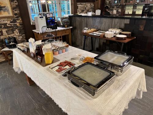 a table with food on it in a restaurant at 日月潭森堡萊夫莊園 in Yuchi