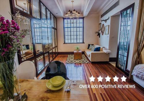 a large living room with a couch and a fireplace at Shanghai Art Decor Suite W Nanjing Rd FFC in Shanghai
