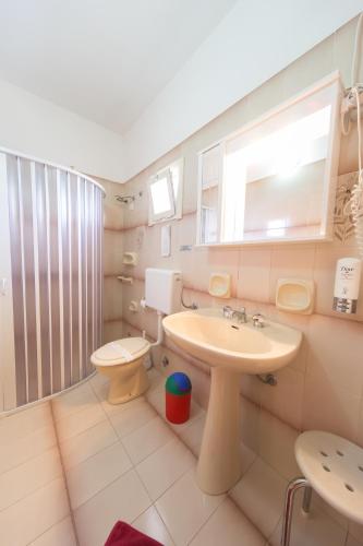 a bathroom with a sink and a toilet at Albergo Europa in Marina di Mancaversa