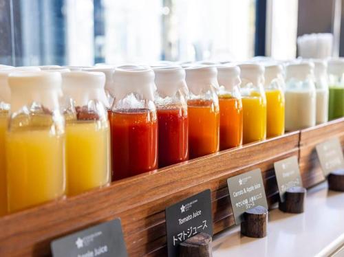 a display of different types of jars of juice at Kyukaruizawa Kikyo, Curio Collection by Hilton in Karuizawa