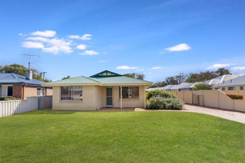 a house in a suburb with a yard at Our Beach House- Busselton in Busselton