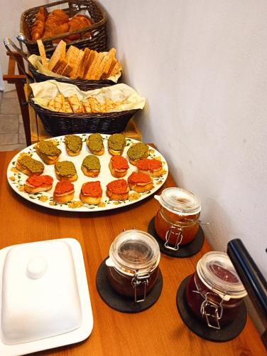 a table with two plates of food and some bread at Hotel Pace in Pompei