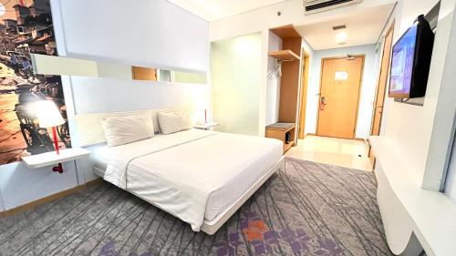 Katil atau katil-katil dalam bilik di Luminor Hotel Metro Indah Bandung - Free Breakfast - Free Exclusive Gym - Free Aesthetic Afternoon Tea or Coffee