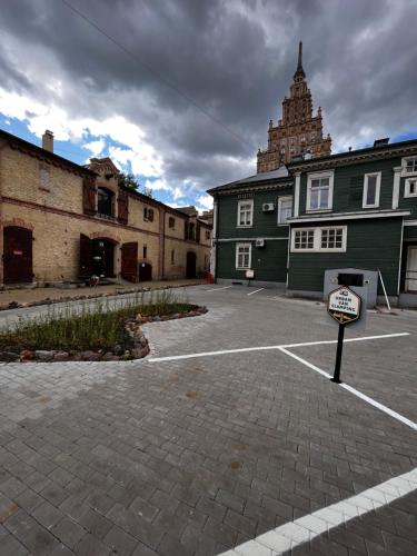 an empty parking lot in front of a building at Urban Van Glamping Riga in Rīga