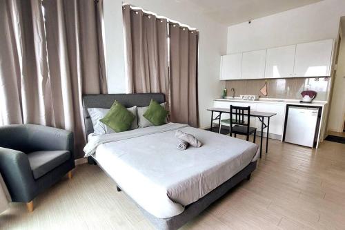 a bedroom with a bed with a cat laying on it at The Grand#11, Free Parking,2pax in Petaling Jaya