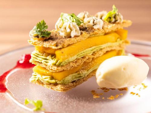a sandwich on a plate with a scoop of ice cream at Kyukaruizawa Kikyo, Curio Collection by Hilton in Karuizawa