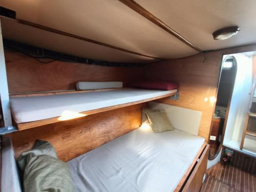 a small bed in the back of a boat at Barca a vela BREEZE in Formia